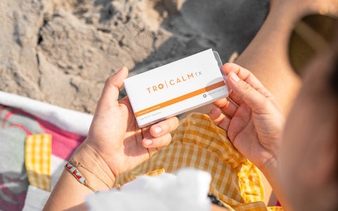 a person holding a box of Tro Calm