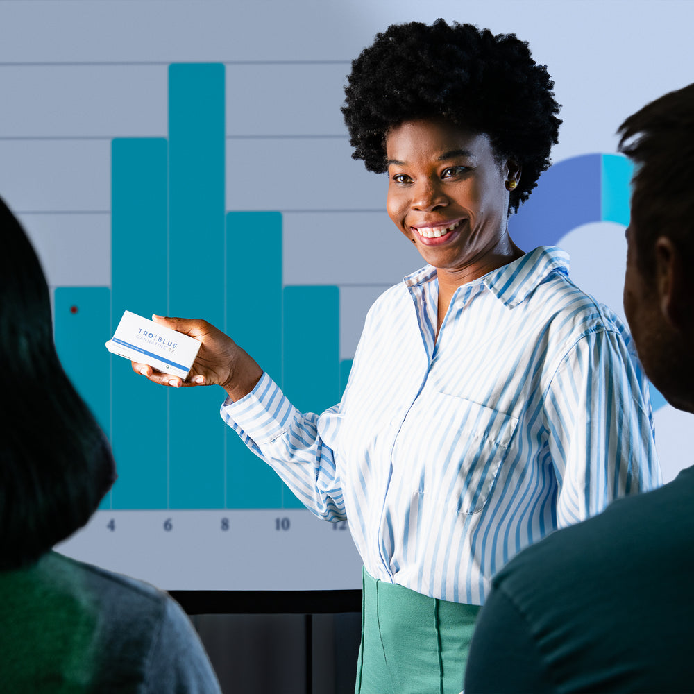 Woman holding Blue Cannatine at work