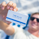 Close up of a Blue Cannatine box being held up