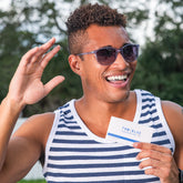 man holding up a box of Blue Cannatine