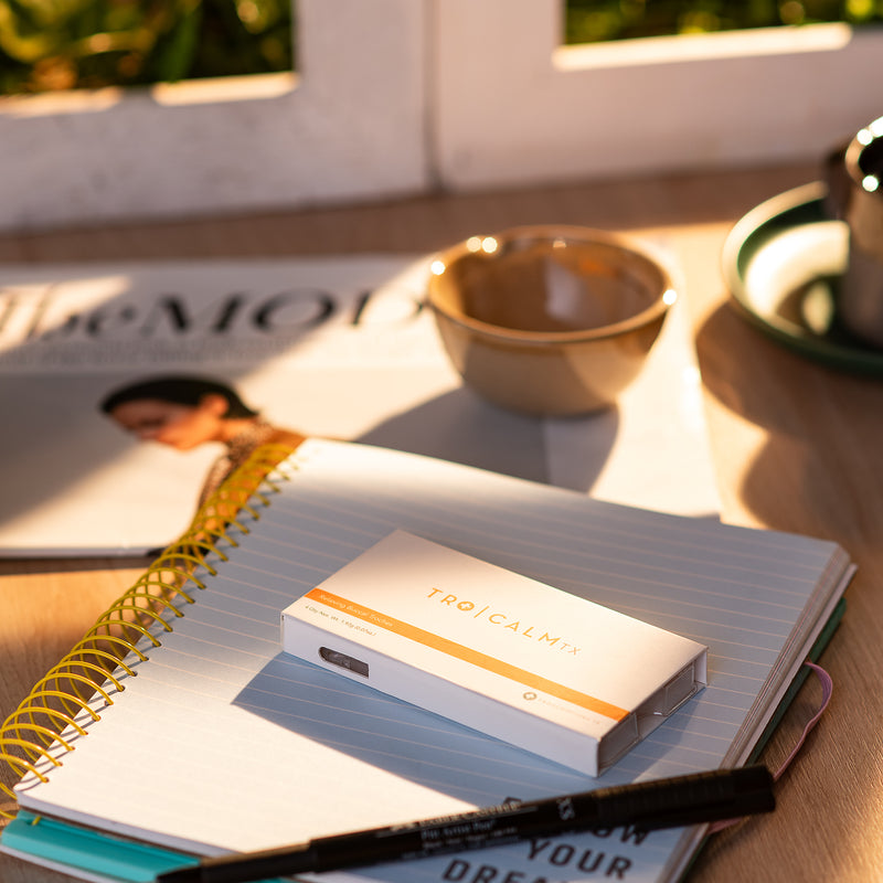 Tro Calm above a notebook
