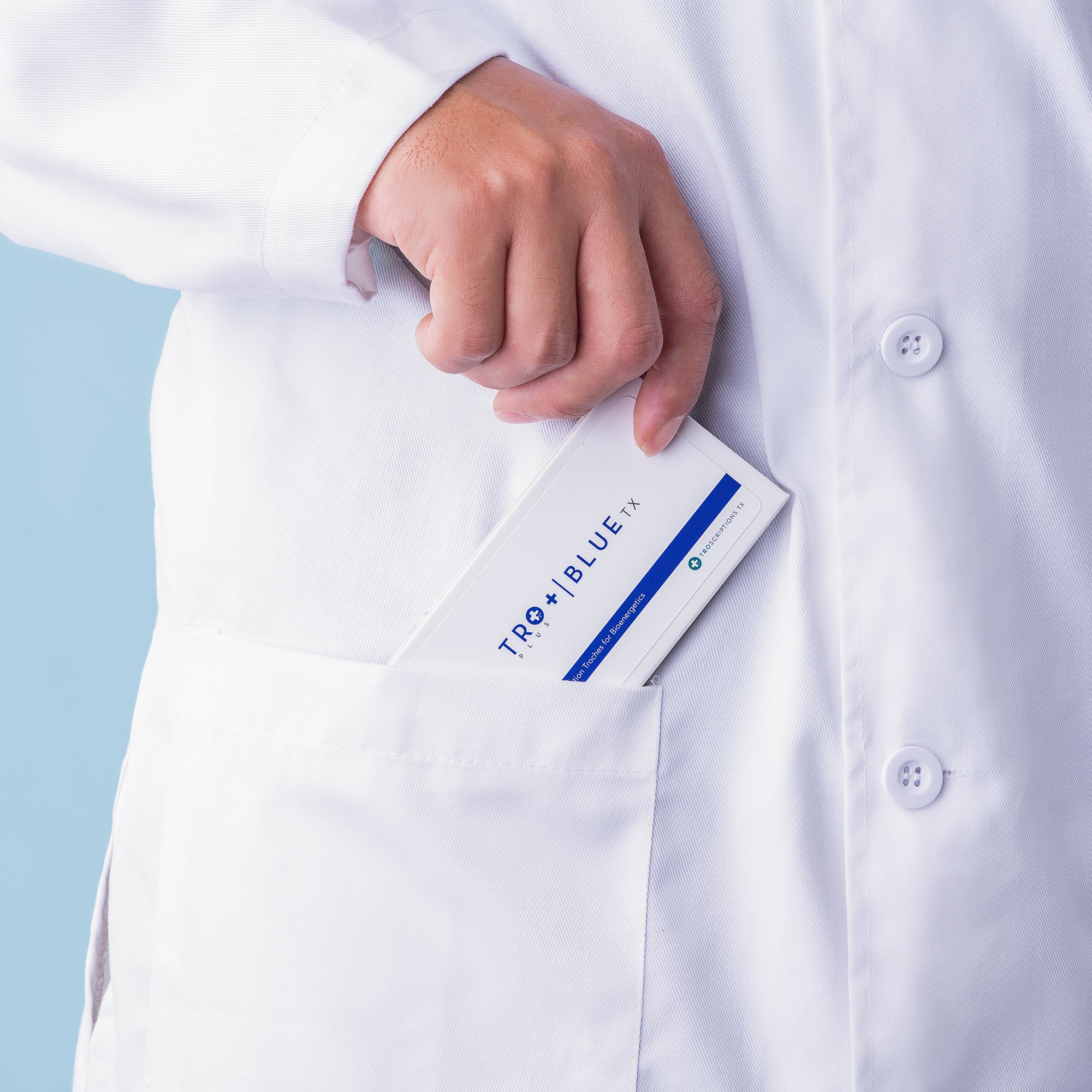 doctor slipping a box of Tro+ Blue into his coat pocket